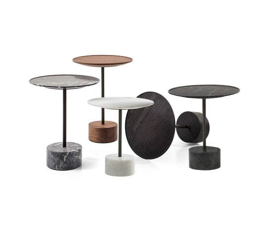 The 9 Occasional Table by Cassina features a modular cylindrical design by Piero Lissoni, offering refined versatility for residential and contract interiors.