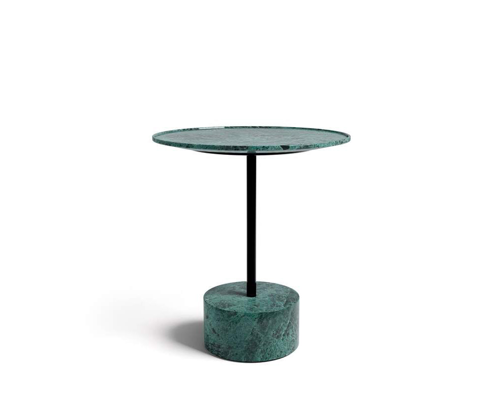 The 9 Occasional Table by Cassina features a modular cylindrical design by Piero Lissoni, offering refined versatility for residential and contract interiors.