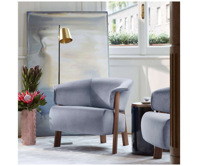 Back-Wing Lounge Chair by Cassina designed by Patricia Urquiola with a solid wood frame and upholstered seat.