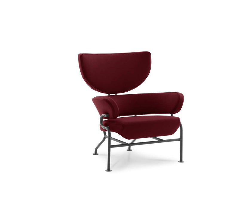 Tre Pezzi Lounge Chair by Cassina designed by Franco Albini with a sculptural upholstered wingback design.