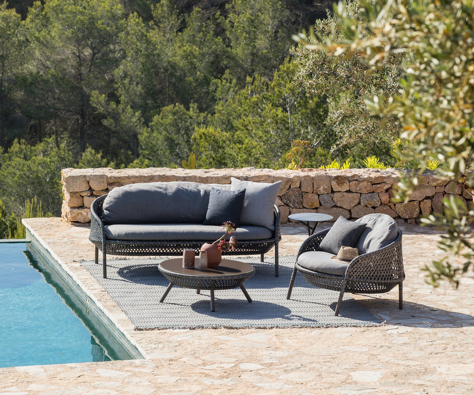 Luxury Ahnda 2-Seater Sofa by Dedon with Handwoven Red Fiber and Cushions | Casa Design Group
