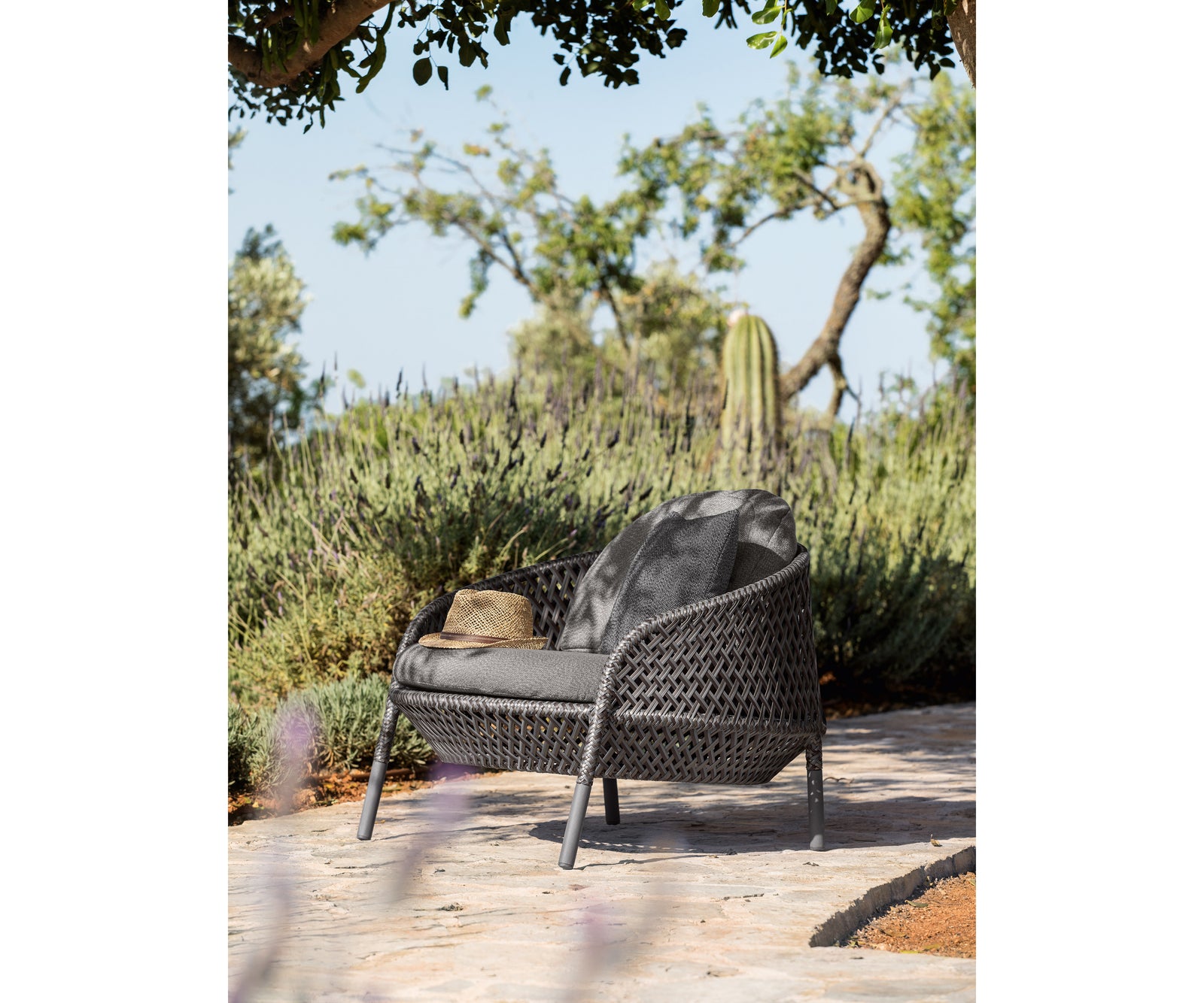 Luxury Ahnda Lounge Chair by Dedon with Open Weave Design | Casa Design Group