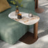 Amalfi C-Table with sculptural steel base, curved metal column and organic ceramic top by Cattelan Italia | Casa Design Group