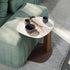 Amalfi C-Table with sculptural steel base, curved metal column and organic ceramic top by Cattelan Italia | Casa Design Group