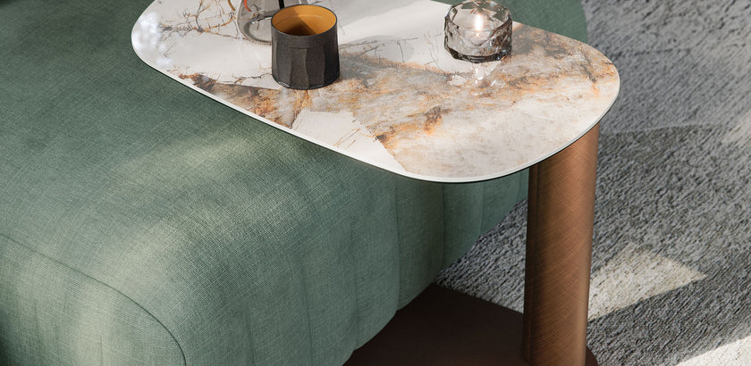 Amalfi C-Table with sculptural steel base, curved metal column and organic ceramic top by Cattelan Italia | Casa Design Group