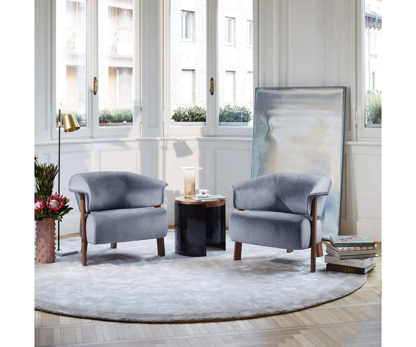 Back-Wing Lounge Chair by Cassina designed by Patricia Urquiola with a solid wood frame and upholstered seat.