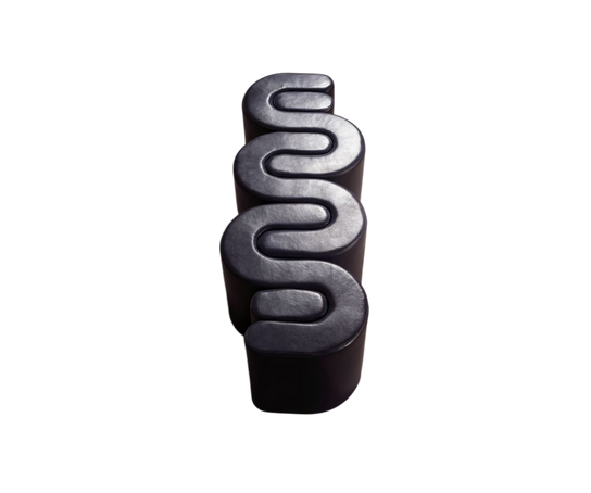 Baxter Adel leather bench with sculptural curved design.