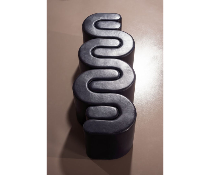 Baxter Adel leather bench with sculptural curved design.