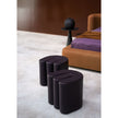 Baxter Adel leather pouf with sculptural curved design.