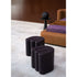 Baxter Adel leather pouf with sculptural curved design.