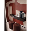 Baxter Adel leather pouf with sculptural curved design.