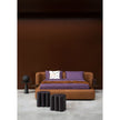 Baxter Adel leather pouf with sculptural curved design.