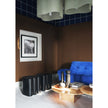 Baxter Adel leather pouf with sculptural curved design.