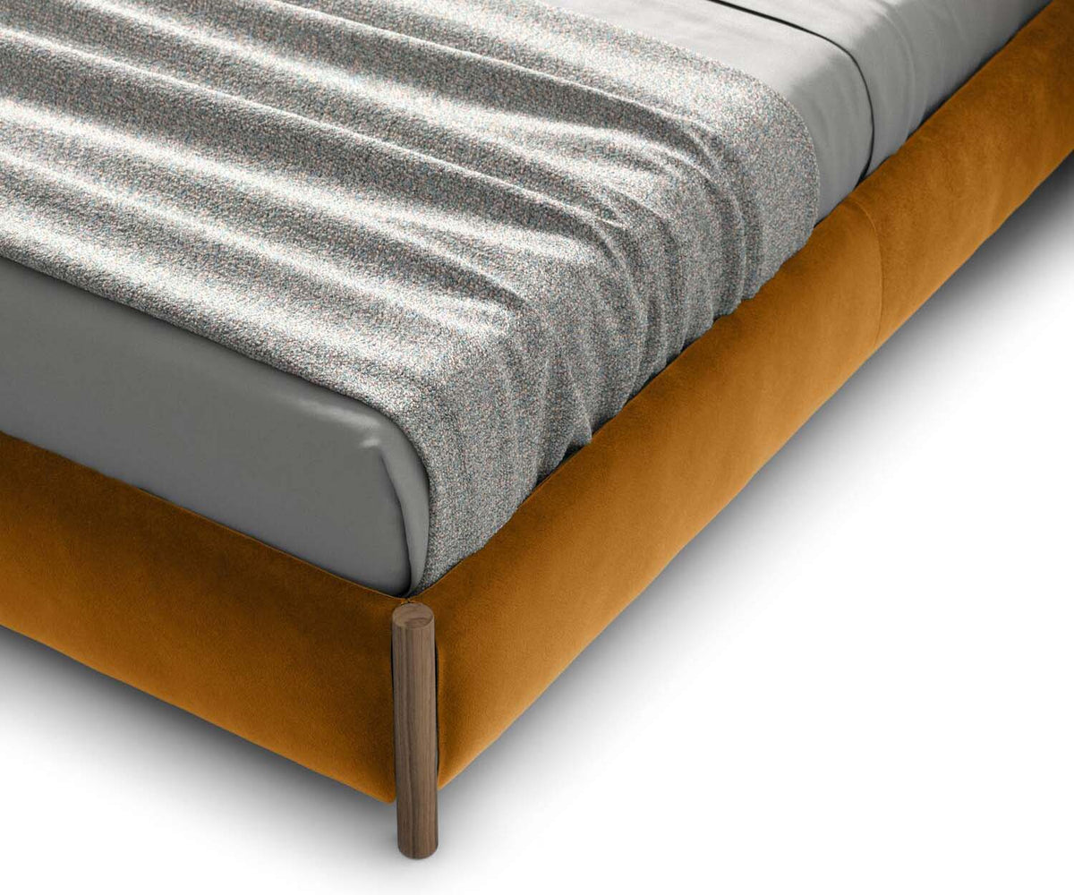 Bio-mbo bed by Cassina with upholstered headboard, storage pockets and modern design – Casa Design Group