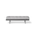 Bonaldo James upholstered bedroom bench with padded seat and painted metal base in a contemporary bedroom setting.