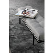 Bonaldo James upholstered bedroom bench with padded seat and painted metal base in a contemporary bedroom setting.