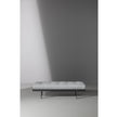 Bonaldo James upholstered bedroom bench with padded seat and painted metal base in a contemporary bedroom setting.