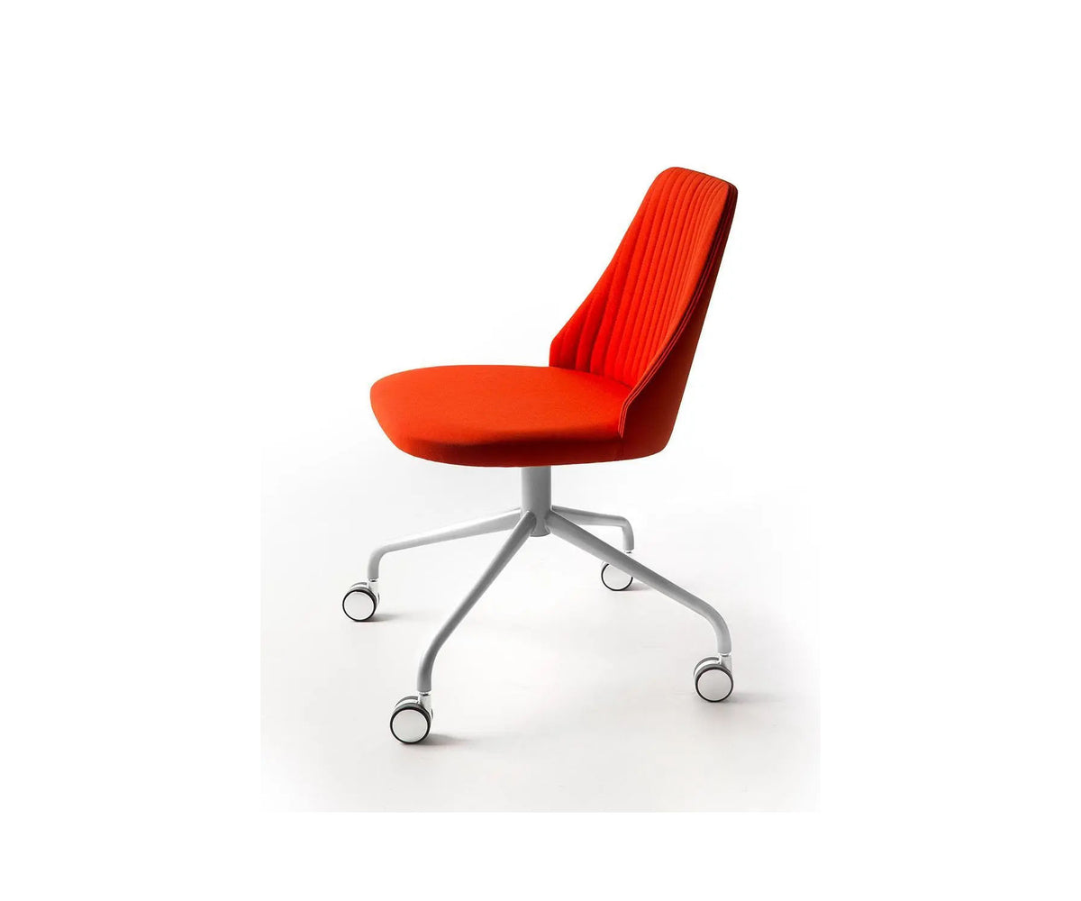 Break 1542 swivel chair by Bross with quilted upholstery and satin chromed base with casters Casa Design Group
