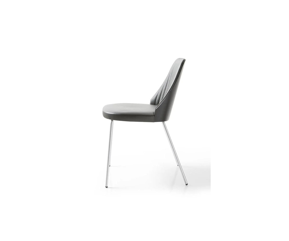 Break 1640 dining chair by Bross with quilted upholstery and satin chromed metal base Casa Design Group