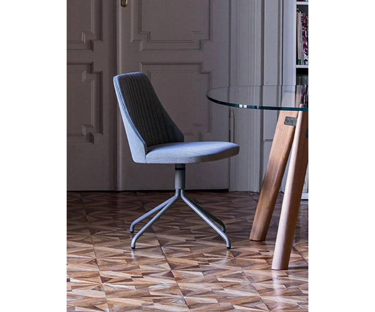 Break 1642 swivel chair by Bross with quilted upholstery and satin chromed metal base Casa Design Group
