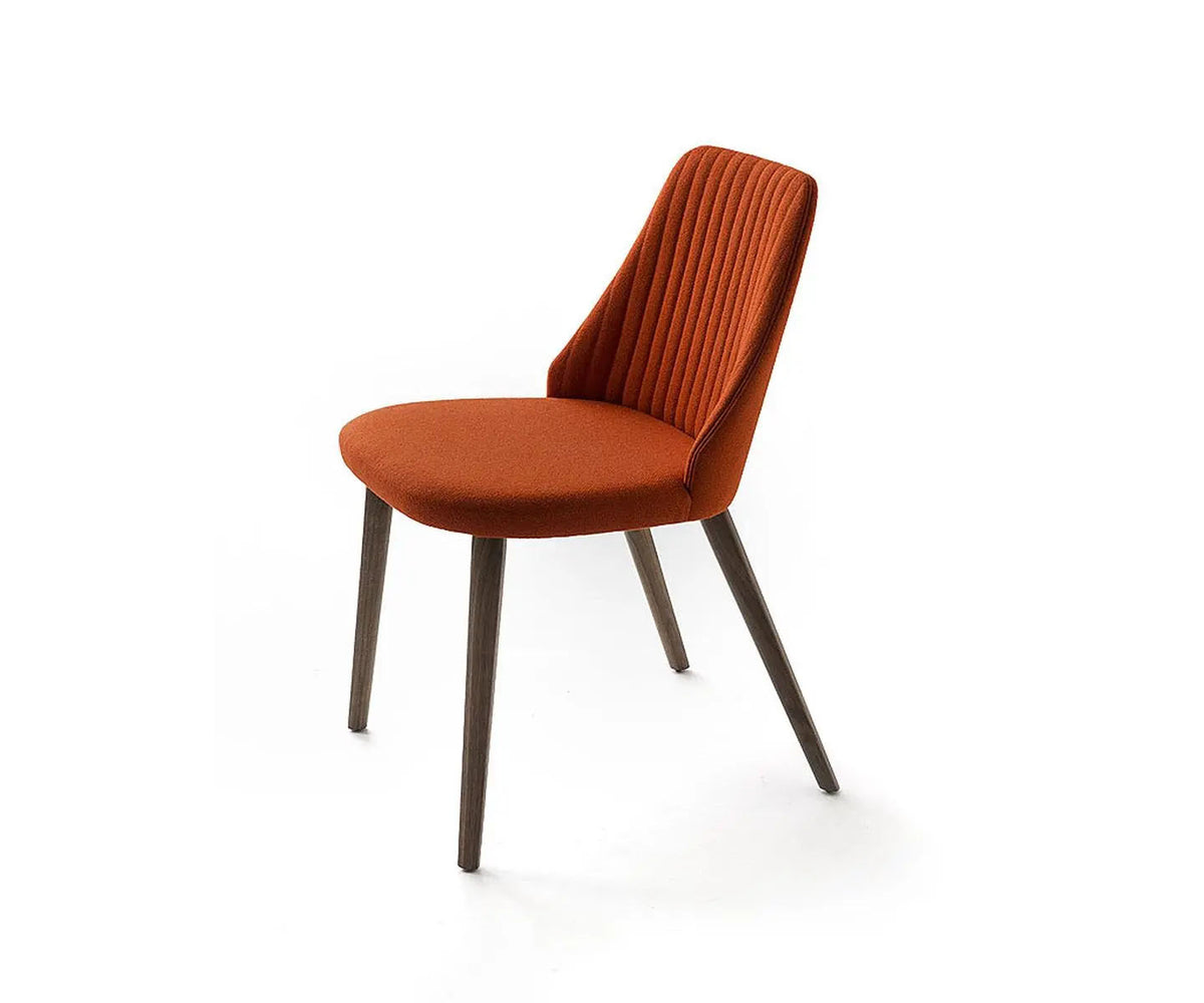 Break 1644 dining chair by Bross with quilted upholstery and beechwood legs Casa Design Group