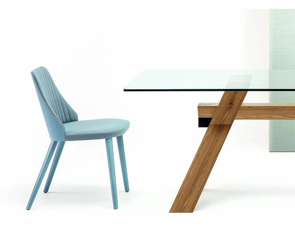 Break 1644 dining chair by Bross with quilted upholstery and beechwood legs Casa Design Group