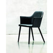 Break 1645 dining armchair by Bross with quilted upholstery and beechwood legs Casa Design Group