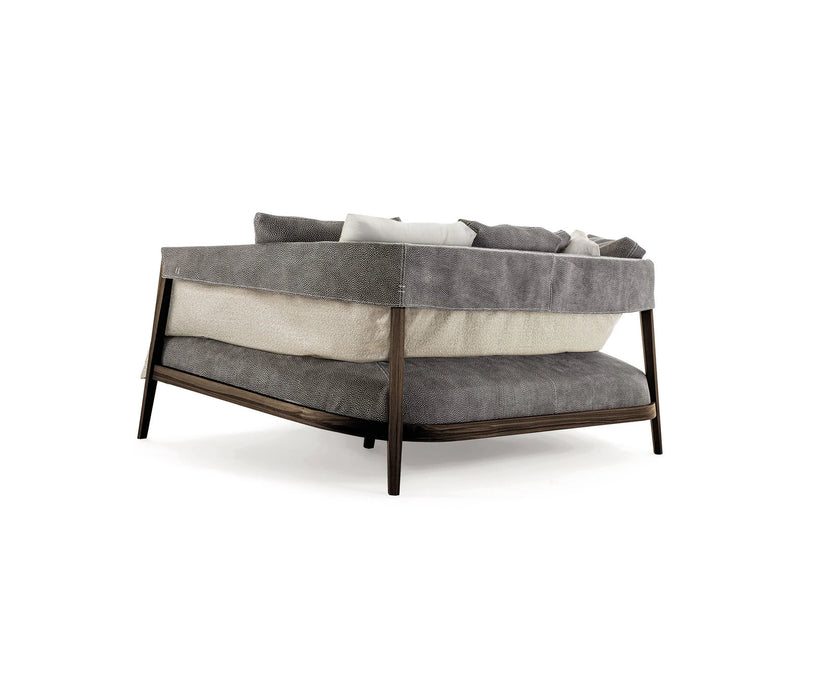 Burton Sofa by Frigerio featuring a solid ashwood frame, angled legs, and a sophisticated leather and fabric upholstery combination | Casa Design Group