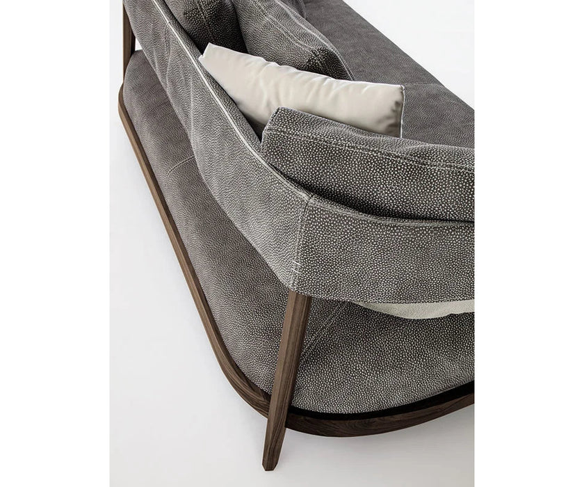 Burton Sofa by Frigerio featuring a solid ashwood frame, angled legs, and a sophisticated leather and fabric upholstery combination | Casa Design Group