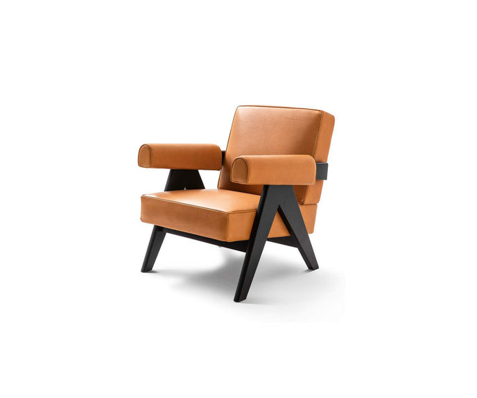 Capitol Complex Lounge Chair by Cassina inspired by Pierre Jeanneret with a solid wood frame and upholstered cushions.