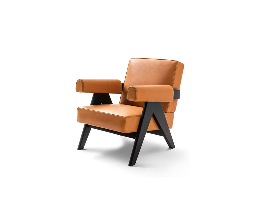 Capitol Complex Lounge Chair by Cassina inspired by Pierre Jeanneret with a solid wood frame and upholstered cushions.