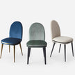 Cremino Dining Chair with rounded upholstered backrest, slender tapered legs and decorative metal ring by Accento | Casa Design Group