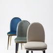 Cremino Dining Chair with rounded upholstered backrest, slender tapered legs and decorative metal ring by Accento | Casa Design Group