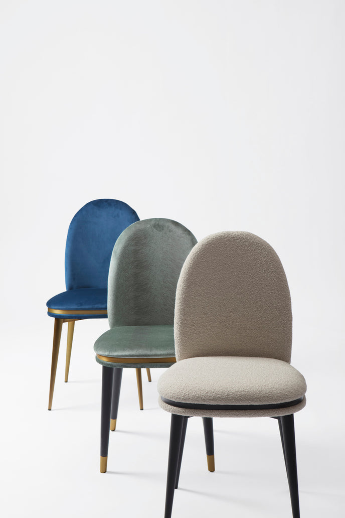 Cremino Dining Chair with rounded upholstered backrest, slender tapered legs and decorative metal ring by Accento | Casa Design Group