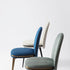 Cremino Dining Chair with rounded upholstered backrest, slender tapered legs and decorative metal ring by Accento | Casa Design Group