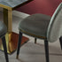 Cremino Dining Chair with rounded upholstered backrest, slender tapered legs and decorative metal ring by Accento | Casa Design Group