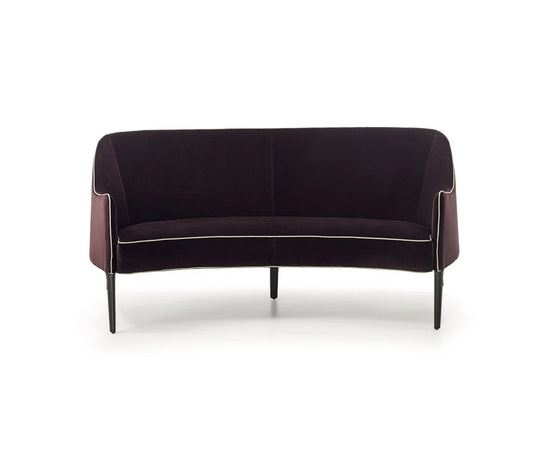 Jackie Bergère Sofa by Frigerio featuring a curved silhouette, sculpted armrests, and a high enveloping backrest | Casa Design Group