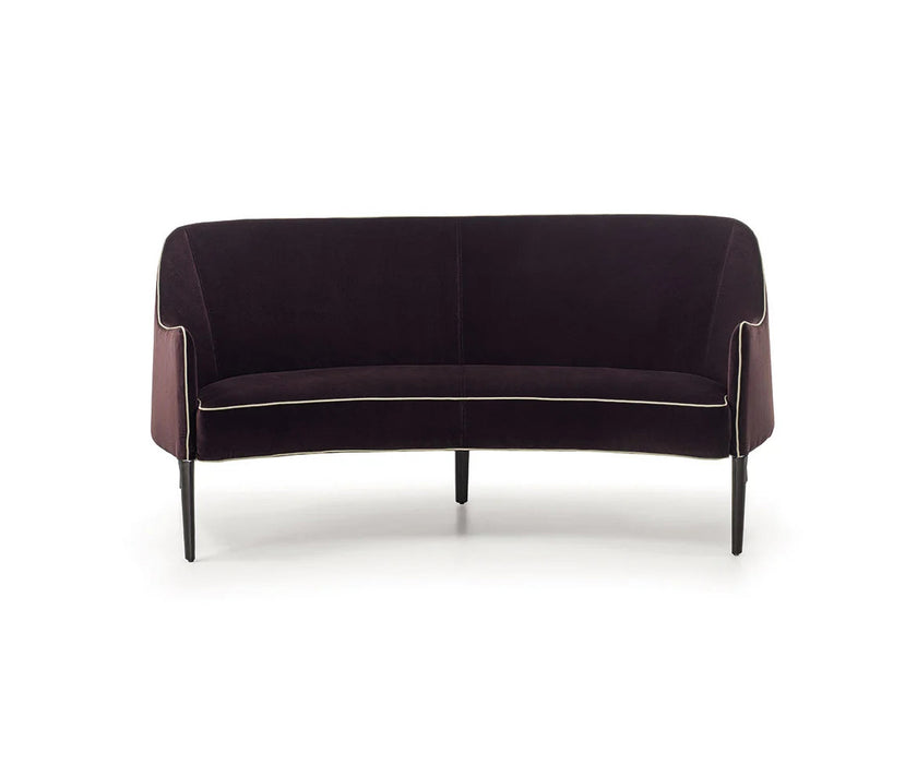Jackie Bergère Sofa by Frigerio featuring a curved silhouette, sculpted armrests, and a high enveloping backrest | Casa Design Group