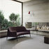 Jackie Bergère Sofa by Frigerio featuring a curved silhouette, sculpted armrests, and a high enveloping backrest | Casa Design Group