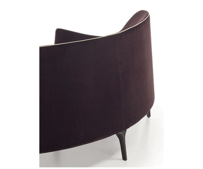 Jackie Bergère Sofa by Frigerio featuring a curved silhouette, sculpted armrests, and a high enveloping backrest | Casa Design Group