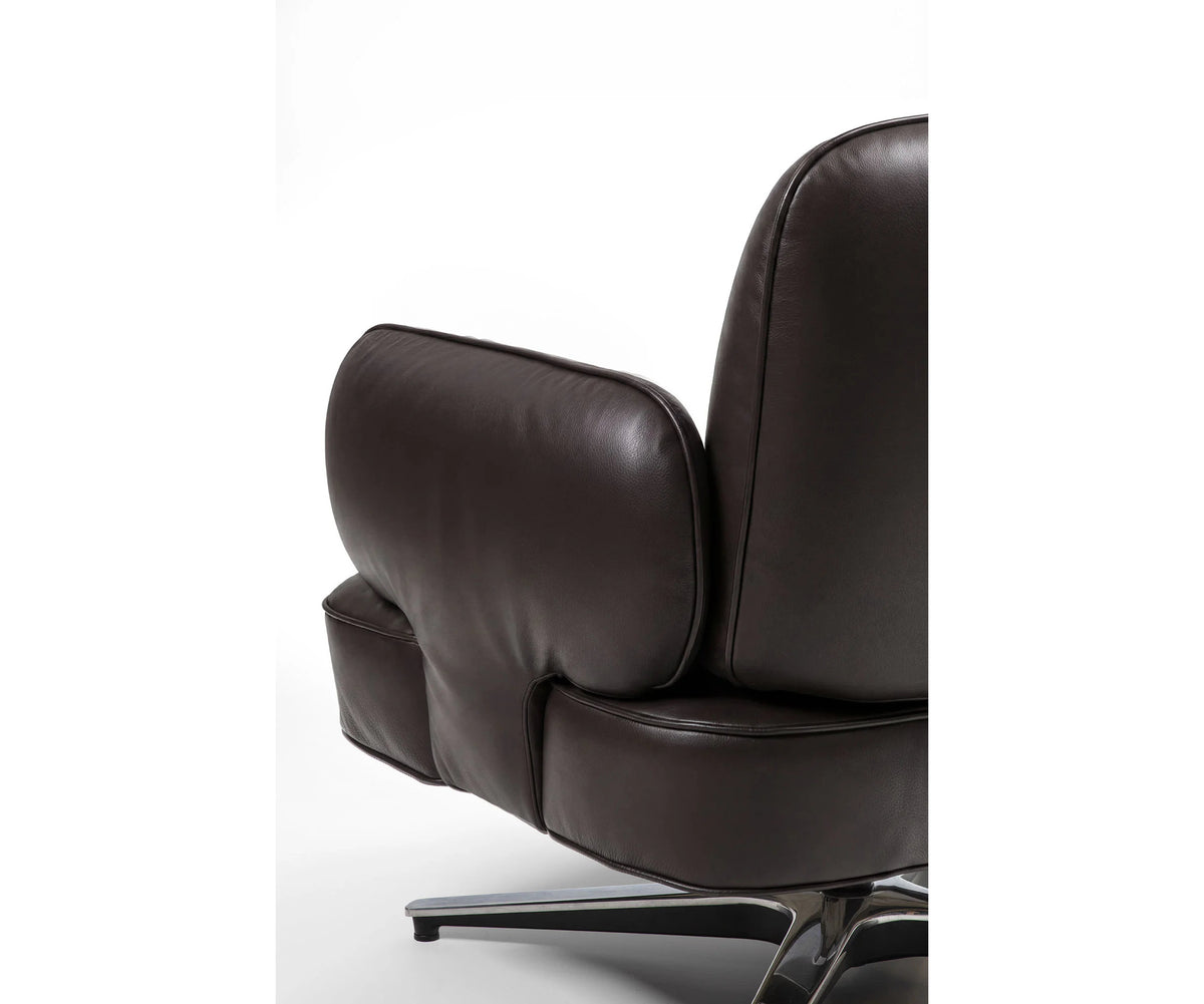 Contemporary Dafne lounge chair by Frigerio with sculptural upholstered design
