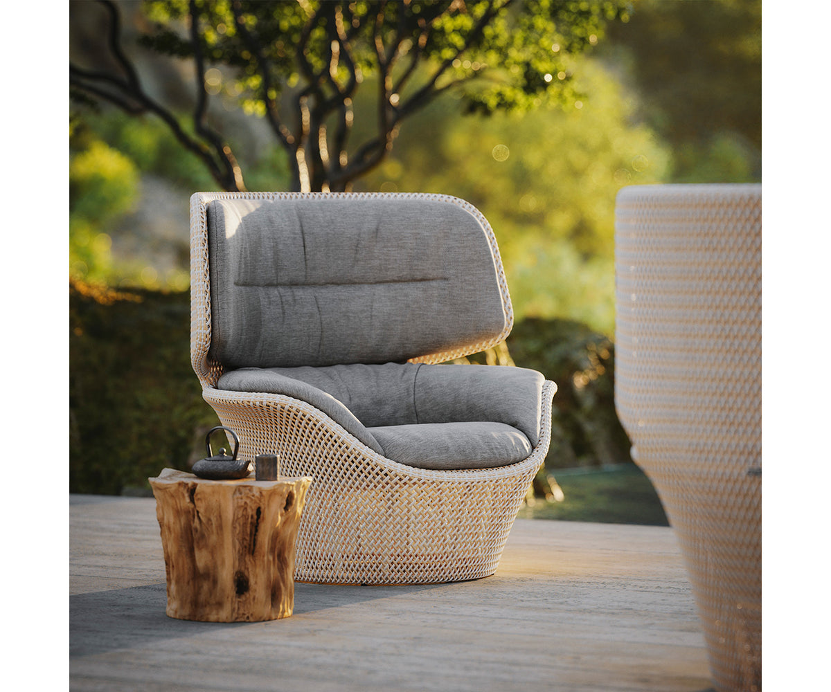 Sustainable luxury wing chair for outdoor lounging by Dedon, Seashell Grand collection – Casa Design Group