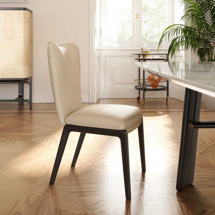 DUO Dining Chair with a high upholstered backrest, solid ash wood legs and tailored leather or fabric upholstery by Ceccotti Collezioni | Casa Design Group