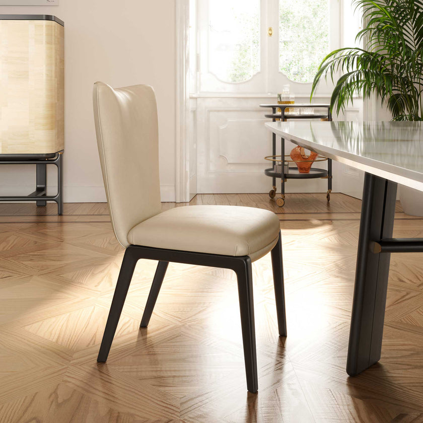 DUO Dining Chair with a high upholstered backrest, solid ash wood legs and tailored leather or fabric upholstery by Ceccotti Collezioni | Casa Design Group