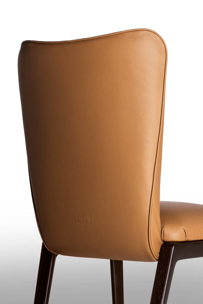 DUO Dining Chair with a high upholstered backrest, solid ash wood legs and tailored leather or fabric upholstery by Ceccotti Collezioni | Casa Design Group