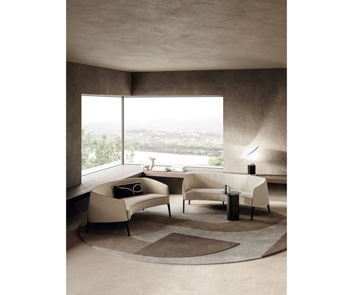Jackie Sofa by Frigerio featuring a curved silhouette, sculpted armrests, and refined Italian craftsmanship | Casa Design Group