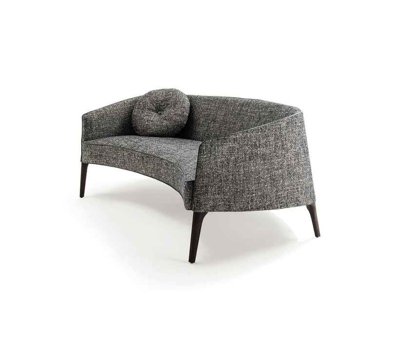 Jackie Sofa by Frigerio featuring a curved silhouette, sculpted armrests, and refined Italian craftsmanship | Casa Design Group