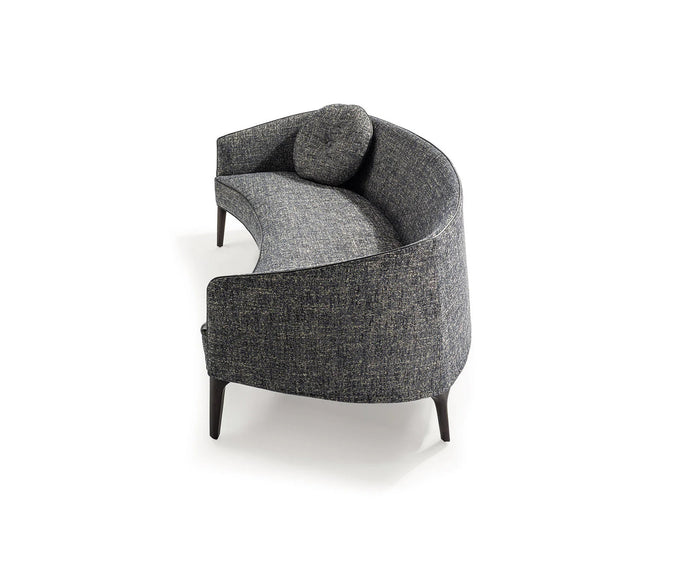 Jackie Sofa by Frigerio featuring a curved silhouette, sculpted armrests, and refined Italian craftsmanship | Casa Design Group