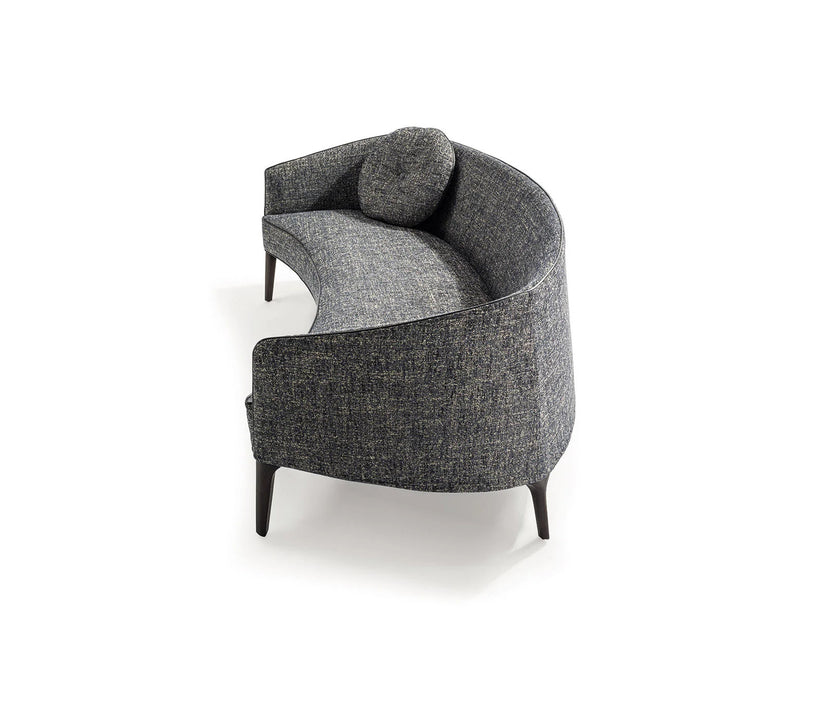 Jackie Sofa by Frigerio featuring a curved silhouette, sculpted armrests, and refined Italian craftsmanship | Casa Design Group