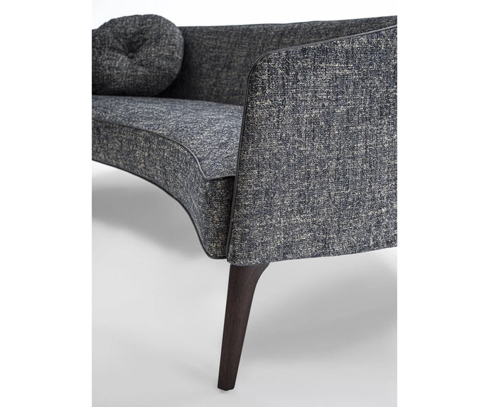 Jackie Sofa by Frigerio featuring a curved silhouette, sculpted armrests, and refined Italian craftsmanship | Casa Design Group